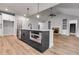 Open-concept kitchen island with stainless steel appliances and sink at 8971 Callaway Dr, Winston, GA 30187