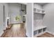 Open living area featuring a stone fireplace, custom shelving, and mudroom at 8971 Callaway Dr, Winston, GA 30187