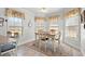 Charming kitchen nook with a wooden table and bright, sunny windows at 121 Desmond Court Ct, Powder Springs, GA 30127