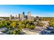 Stunning aerial view of the city skyline surrounded by lush greenery and charming buildings at 3180 Mathieson Ne Dr # 703, Atlanta, GA 30305