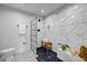 Modern bathroom with a glass-enclosed shower, marble tile, and stylish fixtures at 3180 Mathieson Ne Dr # 703, Atlanta, GA 30305