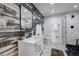 Modern bathroom featuring a marble countertop, stylish fixtures, and a glass-enclosed shower at 3180 Mathieson Ne Dr # 703, Atlanta, GA 30305