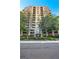 Stately high-rise building featuring classic architecture, lush landscaping, and convenient covered parking at 3180 Mathieson Ne Dr # 703, Atlanta, GA 30305