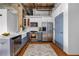Modern kitchen with stainless steel appliances, white cabinets, and an open concept design at 3180 Mathieson Ne Dr # 703, Atlanta, GA 30305