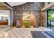 Well-lit lobby with tiled floors, seating, artwork, and convenient access to the building's entrance at 3180 Mathieson Ne Dr # 703, Atlanta, GA 30305
