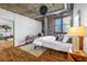 Comfortable main bedroom showcasing hardwood floors, neutral colors, and ample natural light at 3180 Mathieson Ne Dr # 703, Atlanta, GA 30305
