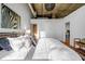 Cozy main bedroom with hardwood floors and exposed ductwork on the ceiling at 3180 Mathieson Ne Dr # 703, Atlanta, GA 30305