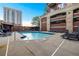 Outdoor pool area surrounded by lounge chairs, providing a refreshing oasis for relaxation and recreation at 3180 Mathieson Ne Dr # 703, Atlanta, GA 30305