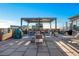 Inviting rooftop deck with pergola, barbecue, fire pit, lounge chairs, and city views at 3180 Mathieson Ne Dr # 703, Atlanta, GA 30305