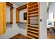 Well-organized walk-in closet with custom wood shelving, hanging rods, and safe for secure storage at 3180 Mathieson Ne Dr # 703, Atlanta, GA 30305