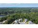 Aerial view of a house with a lake and mountain views in the background at 520 Andes Ln, Canton, GA 30114