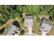 Aerial view of houses nestled in a wooded neighborhood at 520 Andes Ln, Canton, GA 30114