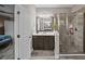 Modern bathroom with a large walk-in shower and dark wood vanity at 520 Andes Ln, Canton, GA 30114