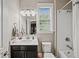 Clean bathroom with a shower/tub combo, white subway tile, and a dark vanity at 520 Andes Ln, Canton, GA 30114