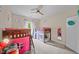 Bedroom with bunk beds, pink accents, and a ceiling fan at 520 Andes Ln, Canton, GA 30114