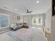 Spacious bonus room with L-shaped sectional sofa and large windows at 520 Andes Ln, Canton, GA 30114