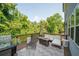 Relaxing deck with seating area, fire pit, and wooded views at 520 Andes Ln, Canton, GA 30114