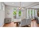 Bright dining room with chandelier and access to deck at 520 Andes Ln, Canton, GA 30114