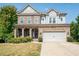 Two-story house with stone accents and a landscaped yard at 520 Andes Ln, Canton, GA 30114