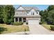Two-story house with stone accents and a landscaped yard at 520 Andes Ln, Canton, GA 30114