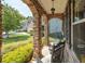 Stone pillars and rocking chairs on a covered porch at 520 Andes Ln, Canton, GA 30114