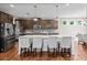 Modern kitchen with large island, granite countertops and stainless steel appliances at 520 Andes Ln, Canton, GA 30114