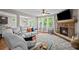 Relaxing living room features hardwood floors, fireplace, and lots of light at 520 Andes Ln, Canton, GA 30114