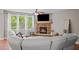 Living room features a fireplace, hardwood floors and large windows at 520 Andes Ln, Canton, GA 30114