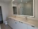 Modern bathroom with double vanity, large mirror, and walk-in shower at 788 W Marietta Nw St # 805, Atlanta, GA 30318