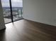Bright bedroom with hardwood floors and floor-to-ceiling windows at 788 W Marietta Nw St # 805, Atlanta, GA 30318
