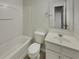 Clean bathroom with a tub, toilet, and vanity with a sink at 720 Crestwell Sw Cir, Atlanta, GA 30331