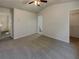 Large bedroom with grey carpet, vaulted ceiling and walk-in closet at 720 Crestwell Sw Cir, Atlanta, GA 30331