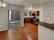 Kitchen with wood cabinets, black appliances, and access to patio at 720 Crestwell Sw Cir, Atlanta, GA 30331