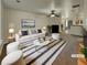 Virtually staged living room with a sofa, coffee table, and fireplace at 720 Crestwell Sw Cir, Atlanta, GA 30331
