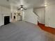 Bright living room featuring gray carpeting and a fireplace at 720 Crestwell Sw Cir, Atlanta, GA 30331