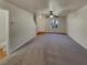 Open living area with gray carpet and access to half bath at 720 Crestwell Sw Cir, Atlanta, GA 30331