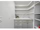 Well-organized pantry with ample shelving and quartz countertop at 436 Valley Brook Ne Dr, Atlanta, GA 30342