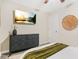 Serene bedroom with a dark dresser and large TV at 2060 Westwood Ave, Atlanta, GA 30310