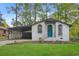 Charming renovated brick ranch home with a covered carport and landscaped lawn at 2060 Westwood Ave, Atlanta, GA 30310
