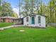 Charming house with teal door and landscaped yard at 2060 Westwood Ave, Atlanta, GA 30310