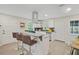 Modern kitchen with white shaker cabinets, granite counters, and stainless steel appliances at 2060 Westwood Ave, Atlanta, GA 30310