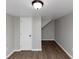 Finished basement room with wood-look floors and extra storage at 2343 Carver Nw Dr, Atlanta, GA 30314