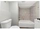 Basement bathroom with a shower/tub combo and tile surround at 2343 Carver Nw Dr, Atlanta, GA 30314