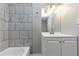 Basement bathroom with a vanity and tile shower/tub at 2343 Carver Nw Dr, Atlanta, GA 30314