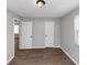 Bedroom with wood floors, two closets, and a window at 2343 Carver Nw Dr, Atlanta, GA 30314