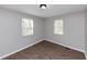 Bright bedroom with wood floors and two windows at 2343 Carver Nw Dr, Atlanta, GA 30314