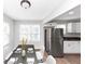 Bright dining area with dark wood table and white chairs, near kitchen at 2343 Carver Nw Dr, Atlanta, GA 30314