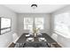 Dining room with dark wood table, white chairs, and natural light at 2343 Carver Nw Dr, Atlanta, GA 30314