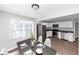 Eat-in kitchen with stainless steel appliances, white cabinets, and dark countertops at 2343 Carver Nw Dr, Atlanta, GA 30314