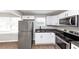 Modern kitchen with stainless steel appliances and white cabinets at 2343 Carver Nw Dr, Atlanta, GA 30314